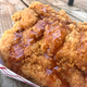 Comically large fried chicken “tenders” drizzled in chipotle-honey sauce